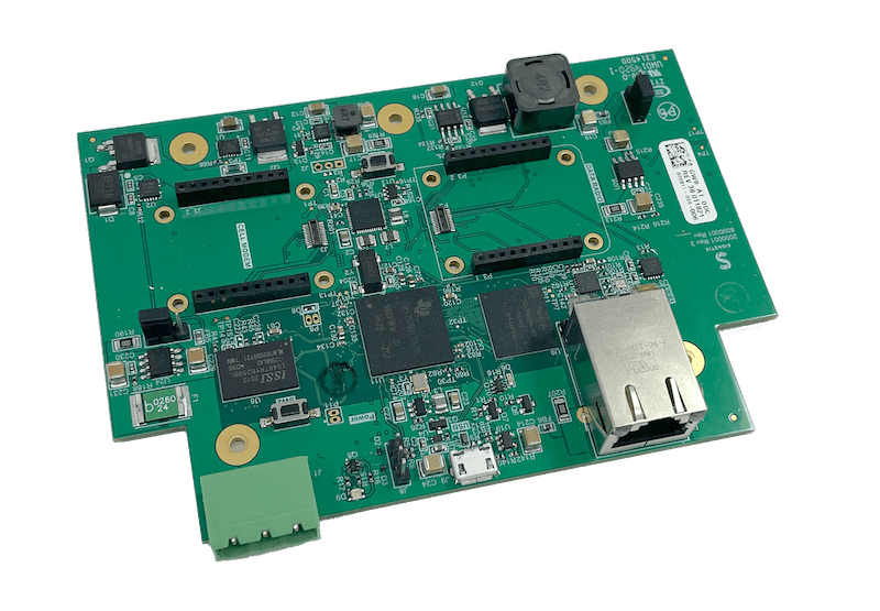 The leads of an electrical multimeter touching a circuit board.